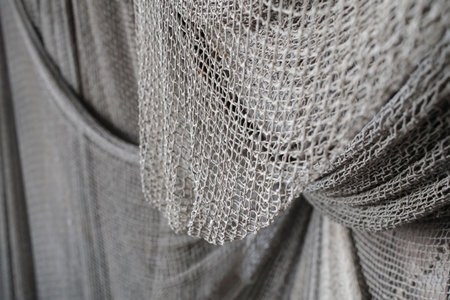 Old fishing nets hung along the walls background