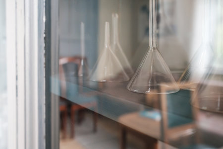 Funnel for a chemical laboratory on a cabinet shelf.の写真素材