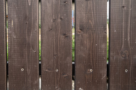 New fence made of brown wooden planks, can be used as a background. Copy space.の写真素材