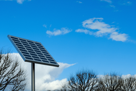 Solar battery on blue sky background. An alternative source of energy.