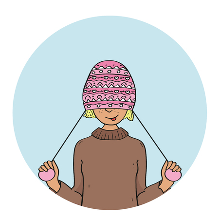 Portrait of young pretty funny smiling girl in cold weather dressed in sweater and warm hat.のイラスト素材