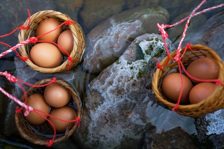 Three baskets of eggs boiled in hot springs Chiang Mai, Thailand. Unusual asian foodの写真素材