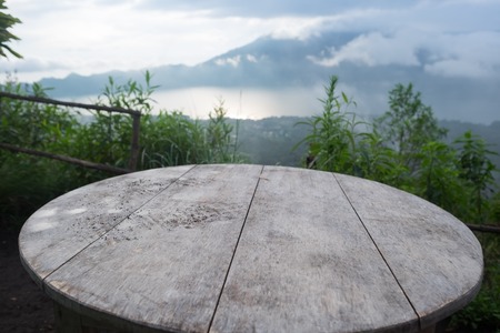 Empty dinner table and morning view over the mountain during sunriseの写真素材