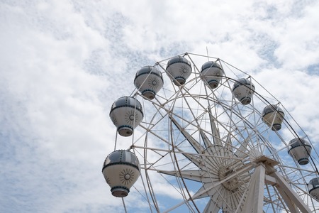 MALACCA, MALAYSIA - FEBRUARY 05, 2018: Colorful ferris wheel on cloudy sky