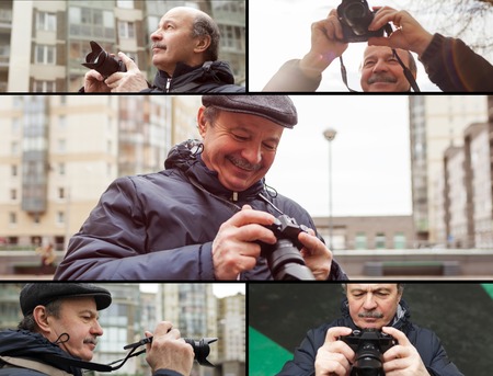 An elderly man with a mirrorless camera chooses a frame on the sの写真素材