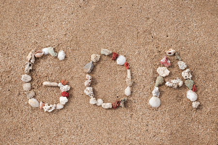 Text GOA made from shells on seashoreの写真素材