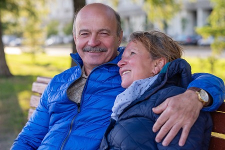 Mature european couple walking on street at good weather in spring.の写真素材