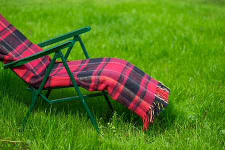 Lounge seat and green grass lawn in country side in summer.の写真素材