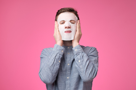 Mature european man in a cosmetic mask for skin care. He is feeling confident and awesome.の写真素材