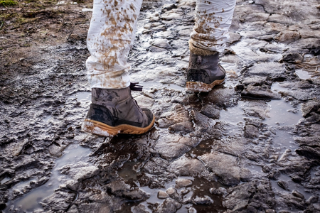 Splashing and melting snow drops on white jeans.の写真素材