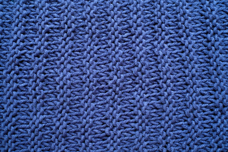Macro of a woolen blue sweater. Knitting Pattern