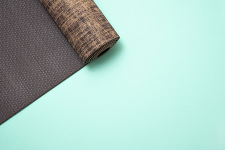 New yoga mat on a colored blue background. Top View with copy space.の写真素材