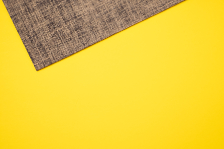 New yoga mat on a colored yellow background. Top View with copy space.の写真素材