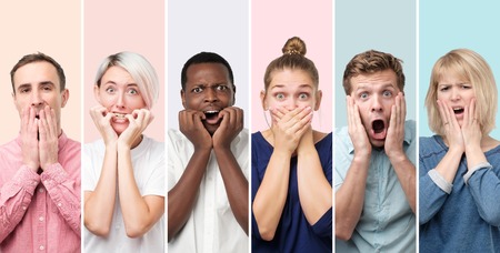 Surprised and astonished people receiving shocking unexpected newsの写真素材