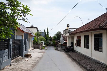 Bali, Indonesia - December 13, 2017: Road in local village with traditional houses in Baliのeditorial素材