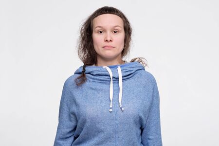 Emotionless, unsentimental phlegmatic caucasian teenager with serious look looking at camera. Photo on id passportの写真素材