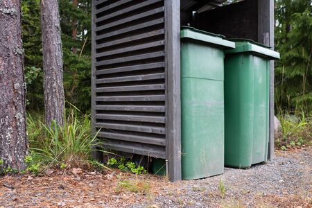 Two colorful green recycle bins outdoor for collecting garbageの写真素材