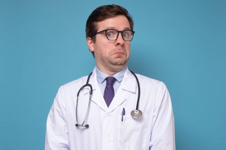 Puzzled male doctor is uncertain about procedureの写真素材