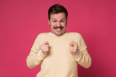 Caucasian funny man finger fig gesture you are going to get nothing. Studio shotの写真素材