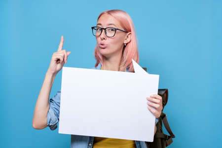 Woman showing sign speech bubble banner pointing up giving adviceの写真素材