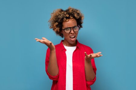 Clueless african student being puzzled stunned unaware about ambiguous problemの写真素材