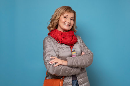 Mature caucasian woman in autumn clothes smiling at cameraの写真素材