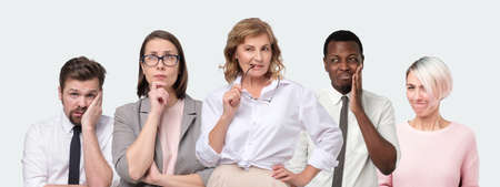 Teamwork concept. Female boss and her colleges trying to find a right decision, thinking.の写真素材