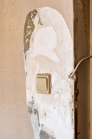 Vintage electrical switch panel on old concrete wall.