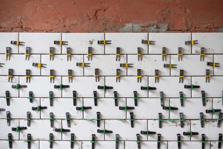View on tile leveling system with plastic clips and wedgesの写真素材