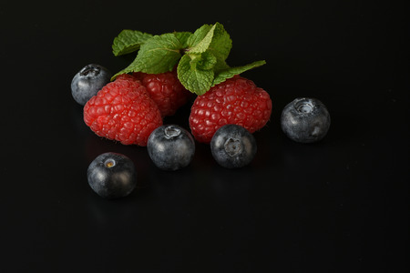 still life of fresh fruits and herbs on a dark background close upの写真素材