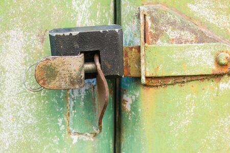 aged rusted metall gate closed steel old padlock for  safety