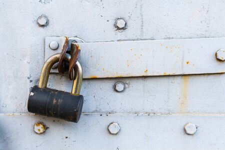 aged rusted metall gate closed steel old padlock for  safety