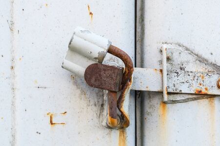 aged rusted metall gate closed steel old padlock for  safety