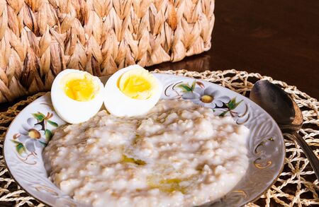 morning breakfast kitchen fresh natural food oatmeal and boiled eggの写真素材