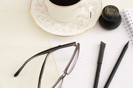 financial manager business accessories for office work glasses cup of coffeeの写真素材