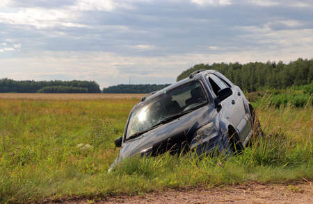 Adventures.Car in a ditch, off-road. front view.