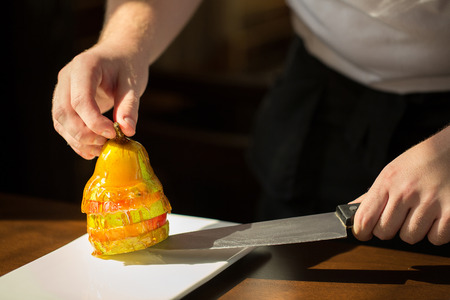 Pear with ricotta cheese, honey and cinnamon on rustic wooden background. Healthy and diet food. Top view.の写真素材