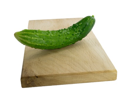 cucumber on cutting board isolatedの写真素材
