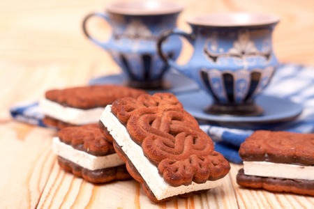 zephyr cookie with tea on wooden background.の写真素材