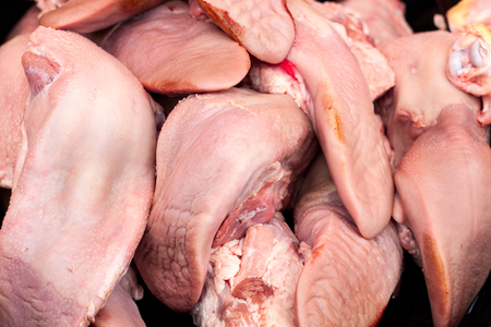 Plenty of fresh pork tongues on the market.の写真素材
