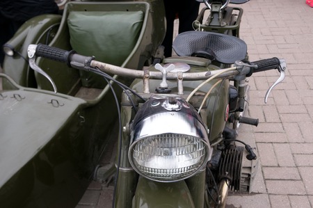 LUGANSK ,UKRAINE - FEBRUARY 25, 2016: Exhibition of vintage cars in the main square, headlight...