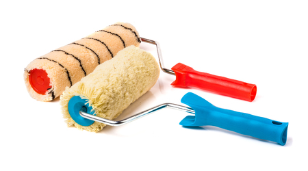 Two paint rollers isolated on white background.