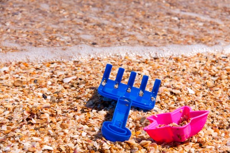 children's toys on the beach on a sunny day.の写真素材