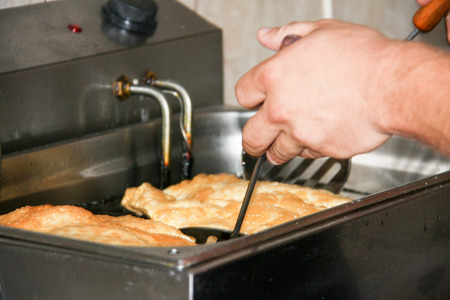 meat pasty fry in a deep fryer. A traditional dish of the Mongol and Turkic peoplesの写真素材