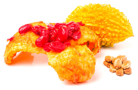 yellow disclosed momordica with seeds isolated on white background.の写真素材