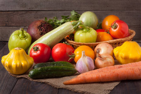 harvest of vegetables on a wooden background.の写真素材
