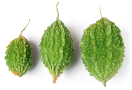three green bitter melon or momordica isolated on white background.の写真素材