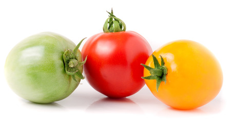 red yellow and green tomatoes isolated on white background.の写真素材