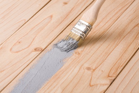 painting wooden board paint brush gray colorの写真素材