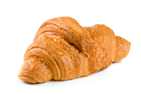 one croissant isolated over a white background closeupの写真素材